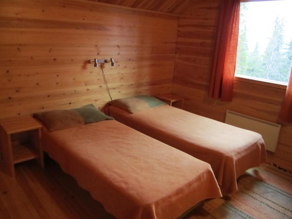 Rukajarven Kelopirtit Cottages Номер фото